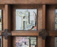 Artwork: Betabet (detail), 2014 by artist Emma Lloyd, Sculpted atlas and compositor's case