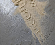 Artwork: Passage (detail) 2019 by artist Emma Lloyd, stencilled sand